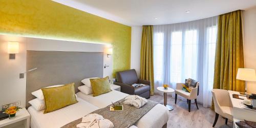 Ένα ή περισσότερα κρεβάτια σε δωμάτιο στο Best Western Plus Hotel Carlton Annecy