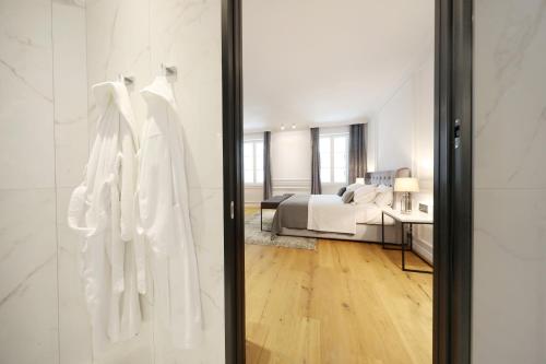 En eller flere senge i et værelse på Greta Residence