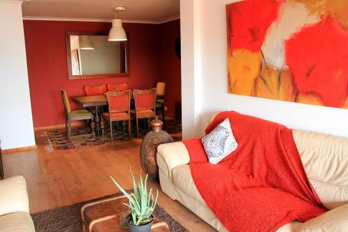 a living room with a couch and a table at Historical Porto/Gaia Apartment in Porto