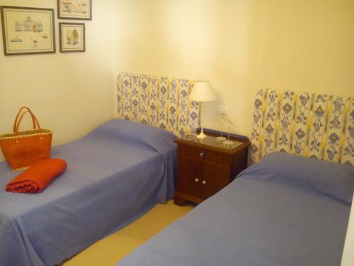 Кровать или кровати в номере Villa Playa Delta del Ebro