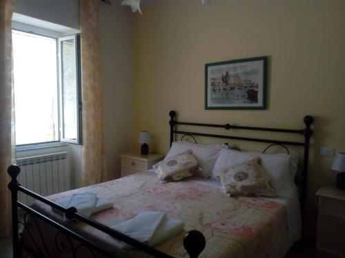 เตียงในห้องที่ Affittacamere Graziella