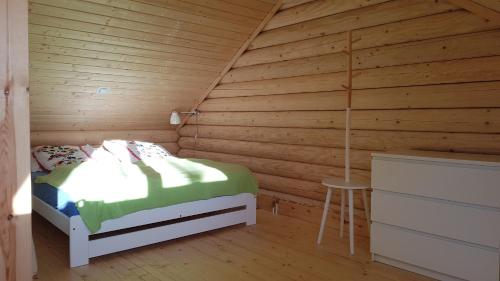 Кровать или кровати в номере "Prawie nad morzem"