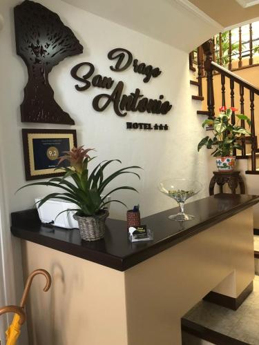 a home bar with a sign on the wall at Hotel Drago San Antonio in Icod de los Vinos