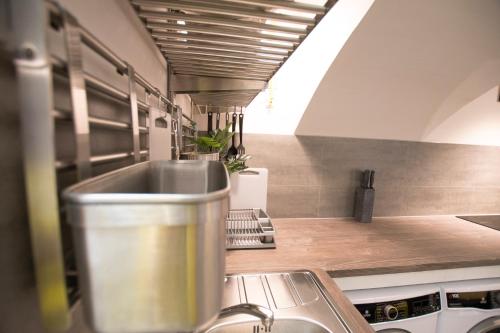 a kitchen with a sink and a counter top at The Maze Apartment in Ljubljana