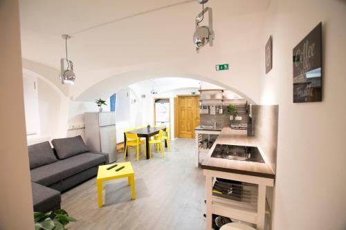 a living room with a couch and a table at The Maze Apartment in Ljubljana