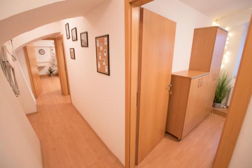 a hallway with a door leading to a room at The Maze Apartment in Ljubljana