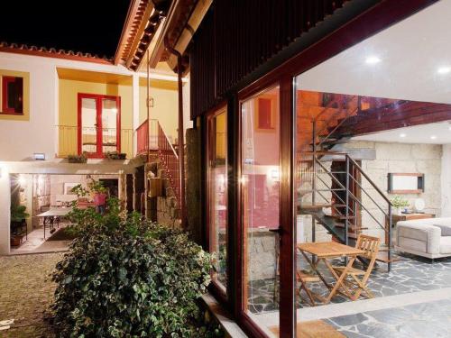 a house with a living room and a staircase at Casa Ci in Vila Franca