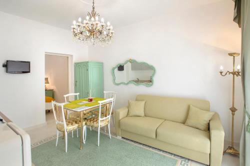 a living room with a couch and a table at à Marchisa -Noto- in Noto