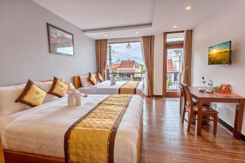 Cama o camas de una habitación en Hoi An Vi Khoa Villa
