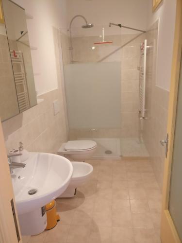 a bathroom with a sink and a toilet and a shower at La Rosa di Orvieto in Orvieto