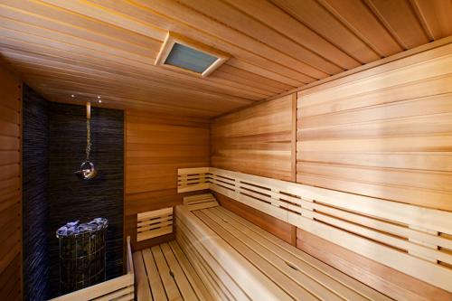 an empty sauna with wooden walls and wooden floors at Černá louže in Branžež