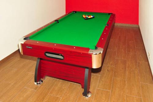 a pool table sitting on top of a floor at Willa Wiktoria in Bukowina Tatrzańska