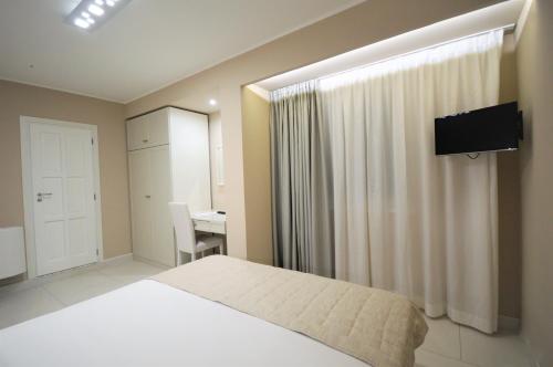 Televisyen dan/atau pusat hiburan di Hotel Residence Il Gabbiano