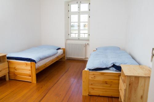 Postel nebo postele na pokoji v ubytování Gästezimmer Mittelgasse