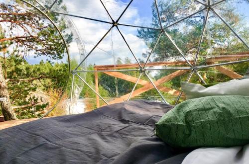 Postel nebo postele na pokoji v ubytování FinnDome