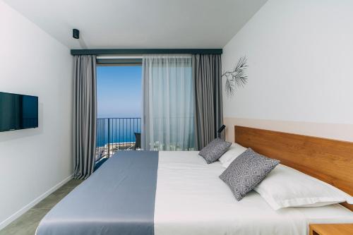 מיטה או מיטות בחדר ב-MORENIA All Inclusive Hotel