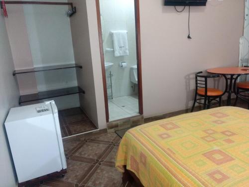 En eller flere senger på et rom på Hotel El Ensueño