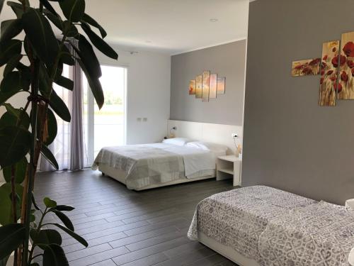 Postel nebo postele na pokoji v ubytování B&B Villa del Lago