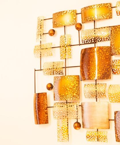 a bunch of gold lights hanging on a wall at Dunperrogh in St. Andrews