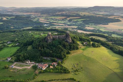 an aerial view of a castle on top of a green field at Hotel Trosky in Troskovice