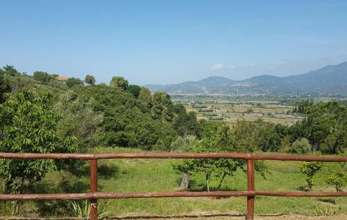 a wooden fence with a view of a valley at Zefiro Casa Vacanze in Ascea