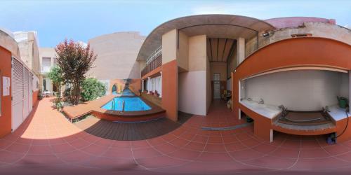 a building with a pool in the middle of it at B&B "Domus Atilia" in Sagunto