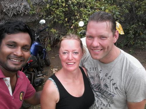 two men and a woman posing for a picture at Lake Cabin in Polonnaruwa