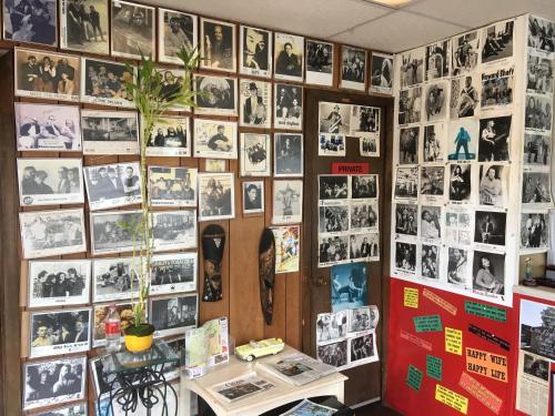 a wall full of photos on a wall at Ole Miss Motel in Oxford