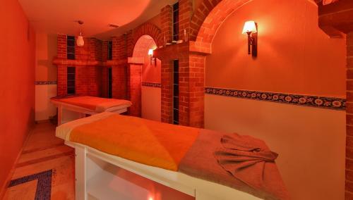 a bedroom with a bed and a brick wall at Ramada By Wyndham İstanbul Taksim in Istanbul