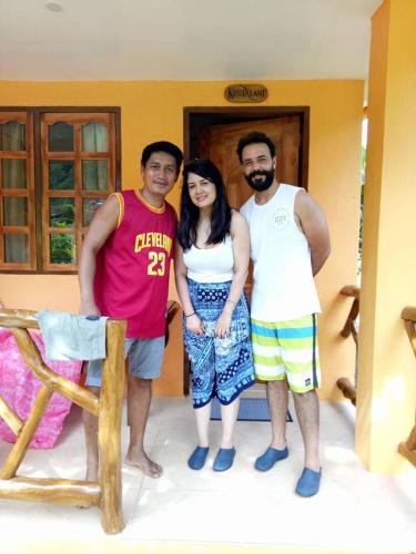 a group of three people standing in a room at Chekesh Casa in Siquijor