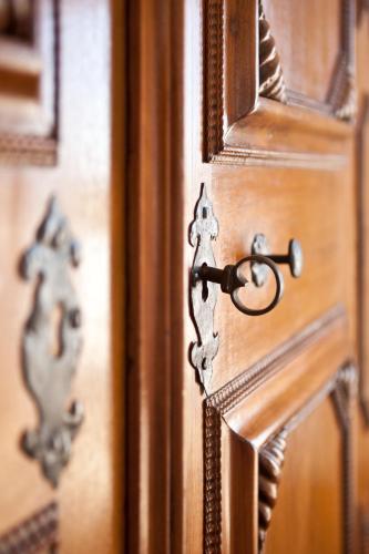 a close up of a wooden door with a latch at Hawksmoor House in Stellenbosch