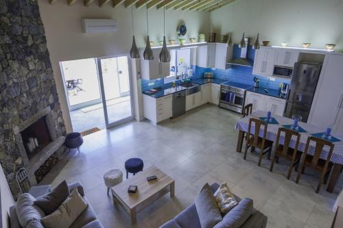 an aerial view of a kitchen and living room at Surf Beach_Santa Barbara Secret Gardens in Ribeira Grande