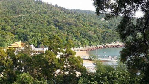 a view of a body of water with a mountain at GOD’S Queen Esther in Nangan
