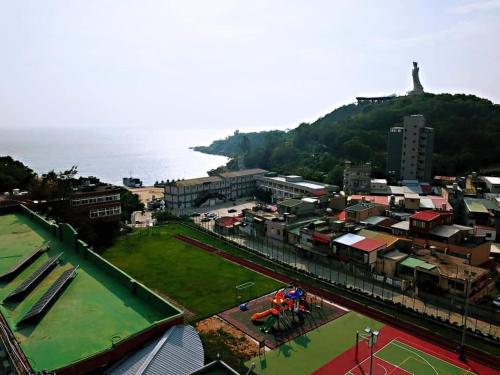 an aerial view of a city with a park at GOD’S Queen Esther in Nangan