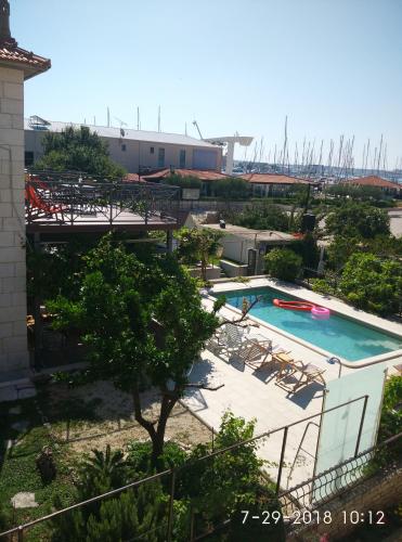 an overhead view of a swimming pool on a building at Apartments Gina in Trogir