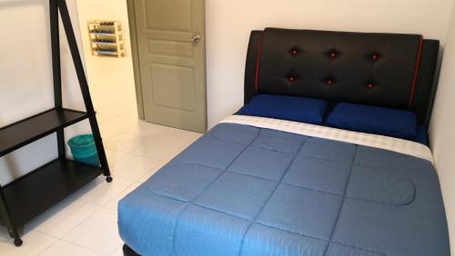Ένα ή περισσότερα κρεβάτια σε δωμάτιο στο My Home Apartment - The Quintet Condo