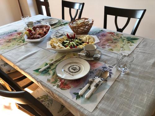 a table with a plate of food on top at Bran Monte Crai Chalet in Bran