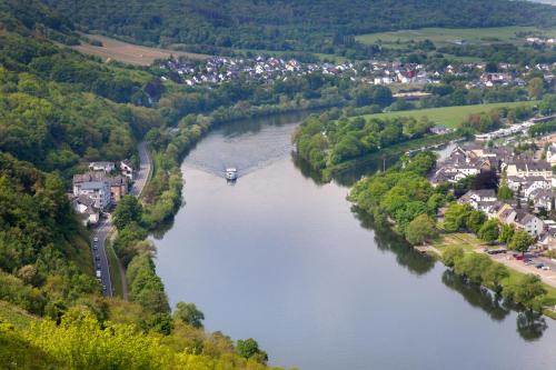 an aerial view of a river with a town at Moselhaus Weiskopf in Bernkastel-Kues
