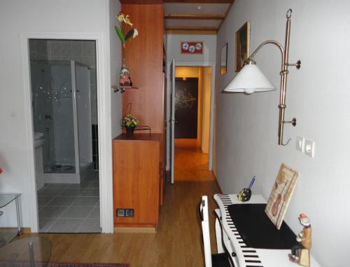 a living room with a table and a dining room at B&B Mirage in Frécourt