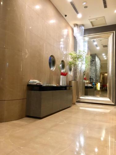 a lobby with a reception desk in a building at City Suites - Taipei Nandong in Taipei