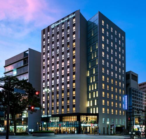 a tall building with lights on in a city at Daiwa Roynet Hotel Chiba-chuo in Chiba