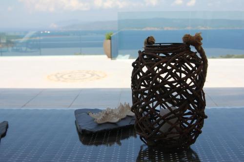 a vase sitting on top of a table at Villa Salina Luxury Pool Villa in Kechria