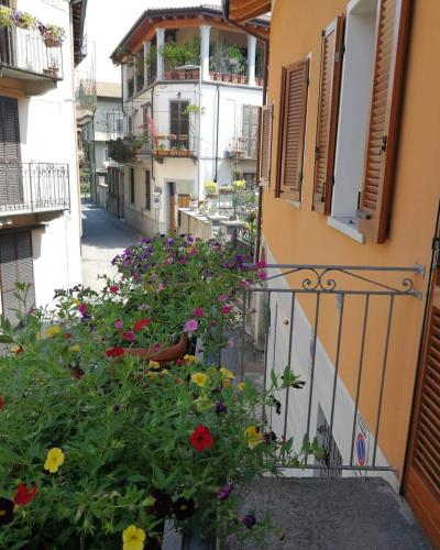 a balcony with flowers on the side of a building at Il Planetario in Verbania