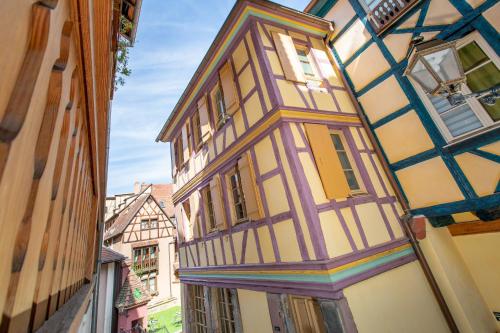 an old building in a street in a city at My Sweet Homes - Le 15 in Colmar