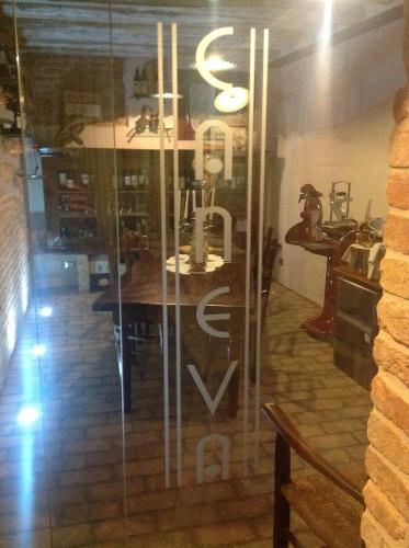 a glass window with a table in a room at Do Ciacole In Relais in Mira
