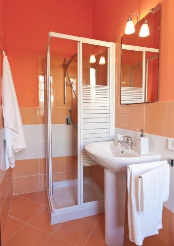 a bathroom with a shower and a sink at Kosmos in Siracusa