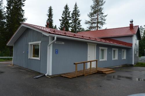 a building with a garage with a lot at Hostel Tikka in Rovaniemi