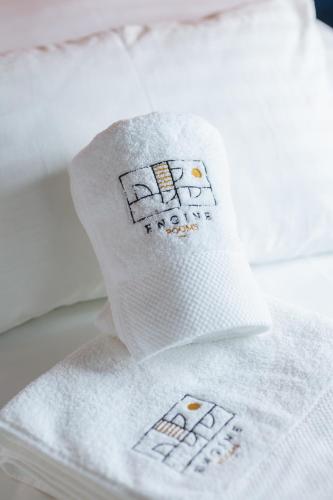 a couple of towels sitting on top of a bed at Engine rooms in Rijeka