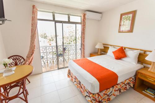 Adulo Apartments tesisinde bir odada yatak veya yataklar