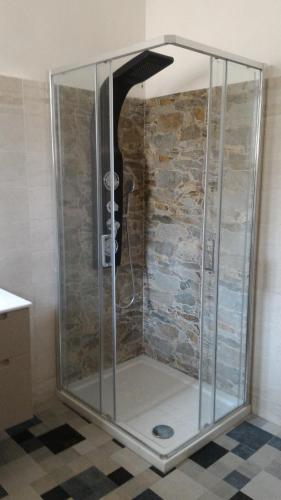 a shower with a glass enclosure in a bathroom at Salentino in Lequile